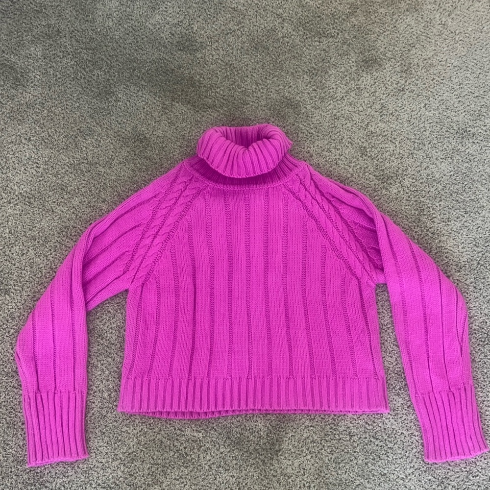 Beautiful turtleneck sweater in a purplish-pink vibrant color.
